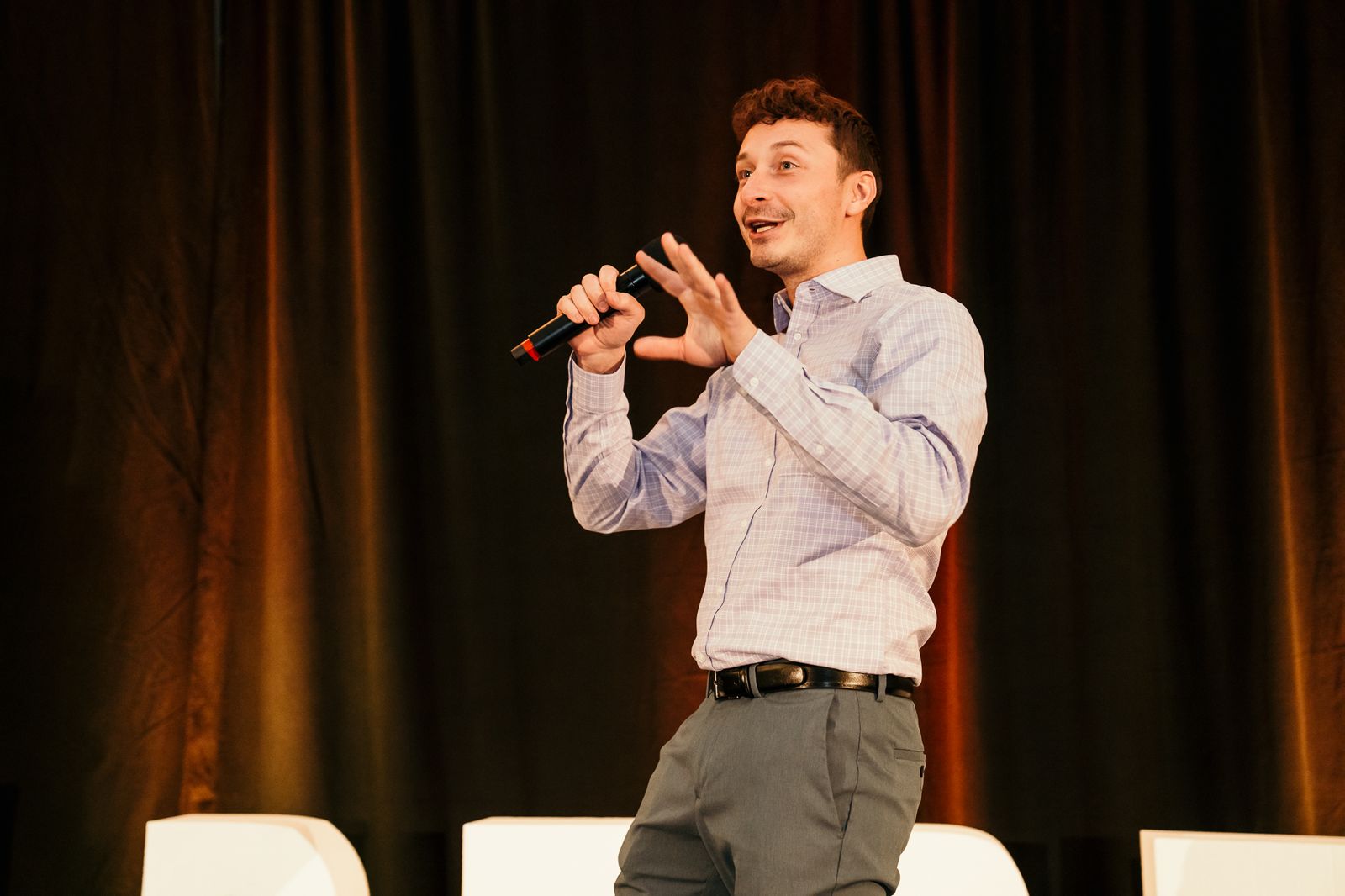 Caleb Bullard speaking on stage